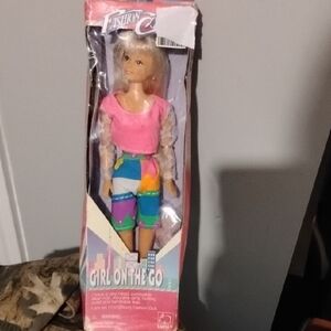 On The Go Doll with Pink Top and Colorful Pants